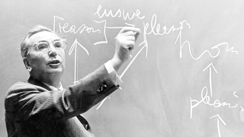 Viktor Frankl teaching at a chalkboard.